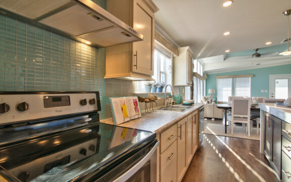 Fabulous glass tile backs plash in the light, bright kitchen of Riviera II manufactured home by Palm Harbor Homes in Plant City, Florida - traditional modern beach style at its best!!