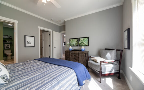 Master bedroom in The Cottage Farmhouse by Palm Harbor Homes. 2 bedrooms 2 bathrooms. 1,387 square feet with built in porch. Only available in Florida. LS28522J
