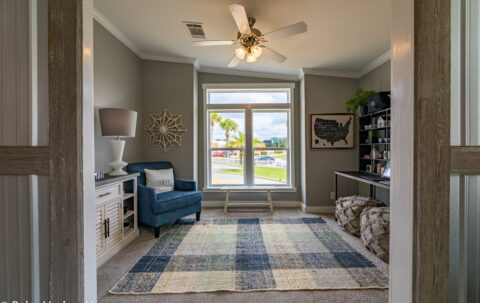 The den or studio/office in The Cottage Farmhouse by Palm Harbor Homes. 2 bedrooms 2 bathrooms. 1,387 square feet with built in porch. Only available in Florida. LS28522J